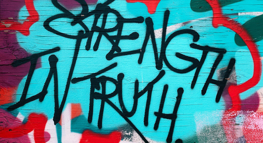 Graffiti that says "Strength in Truth"